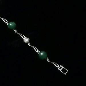 Silverstone bracelet with green stones and cz